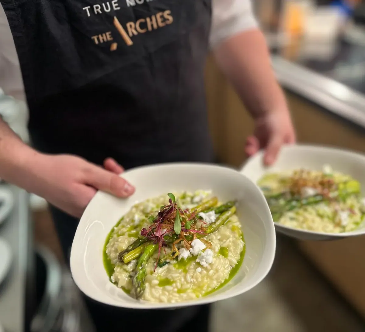 A chef plating a dish at The Arches
