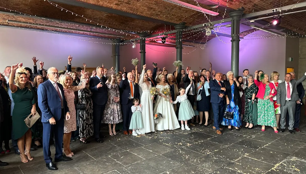 The full hall at The Arches lit for an evening reception, guests filling the floor